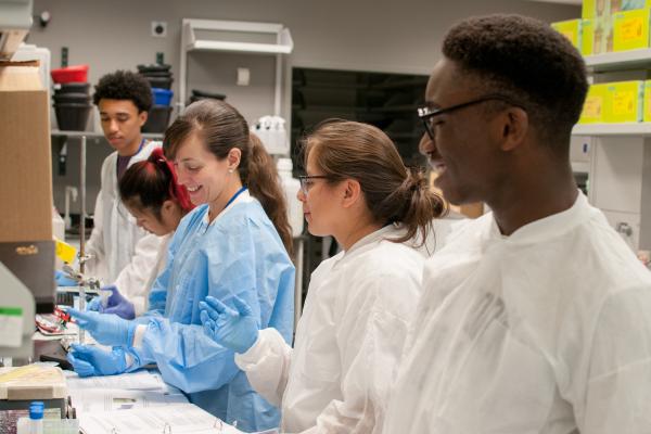 students and instructor in a lab